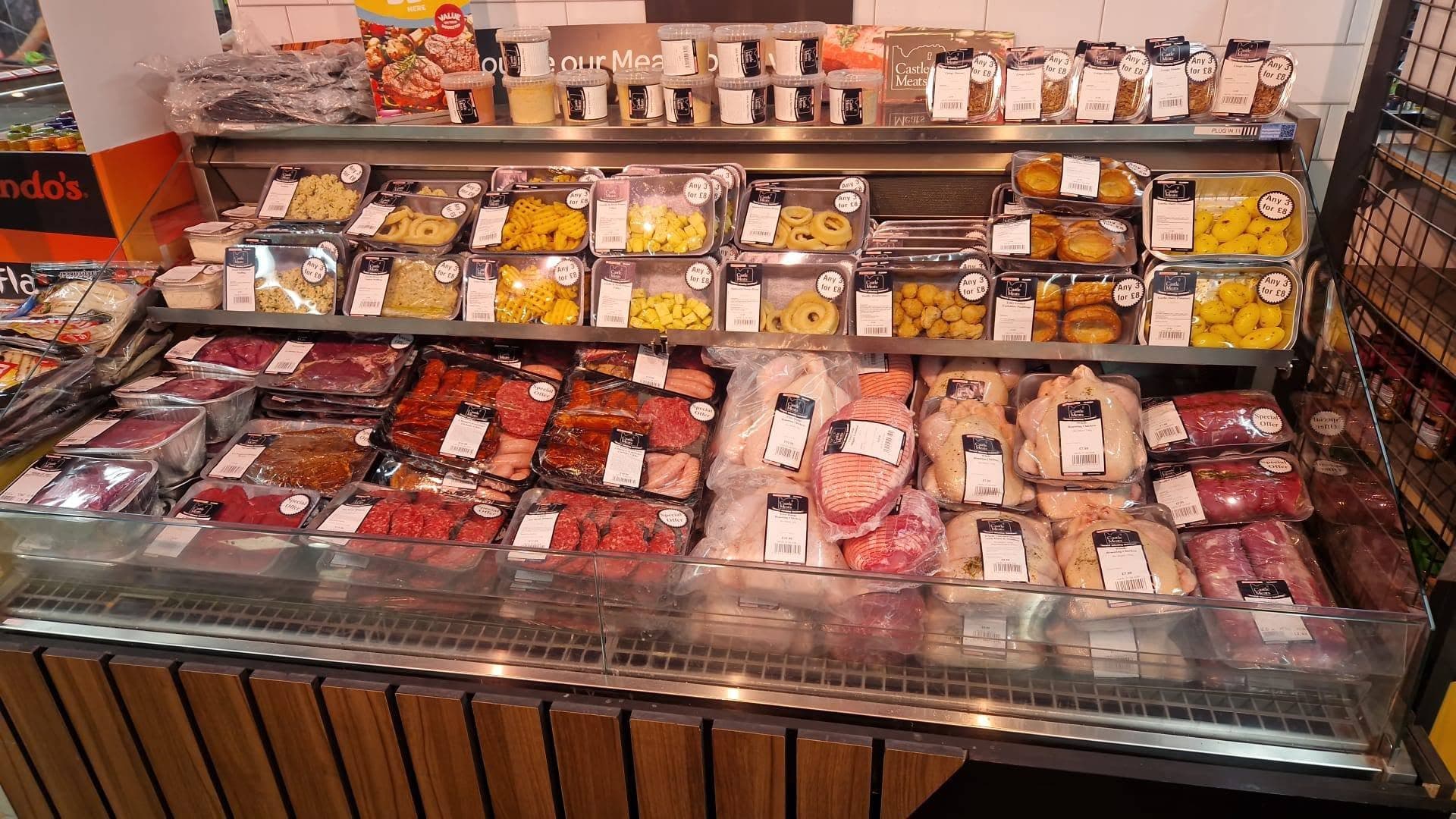 Wide photograph of the Castle Meats meat counter